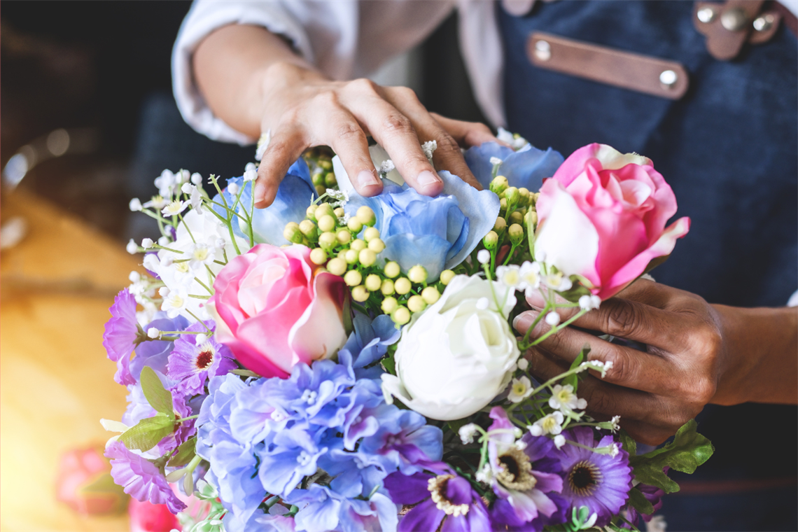 Person arranging flowers