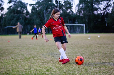 Photo of a girl playing soccer