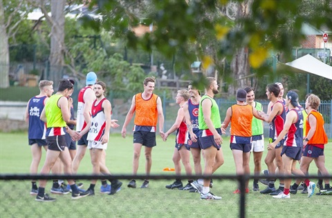 Photo of a sports team outside on a sportsfield