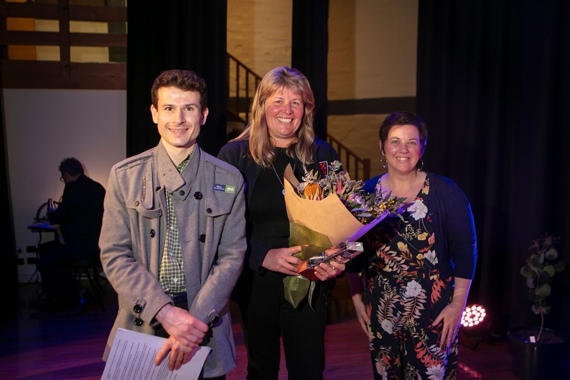 Lisal O'Brien accepts the Volunteer of the Year Award from Mayor Ben Ramcharan