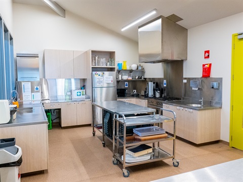 An open modern kitchen under a sloping ceiling