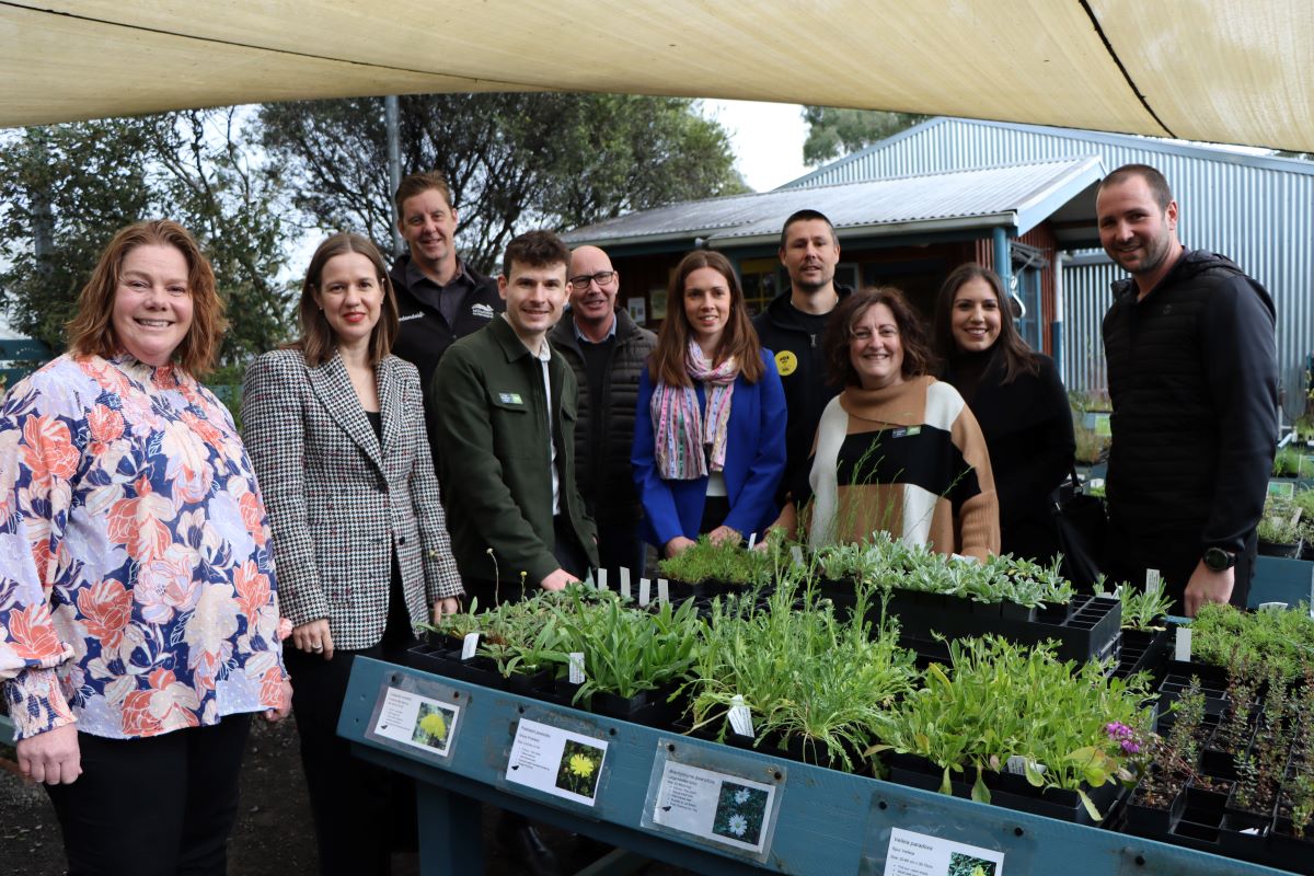 This is photograph taken in the indigenous nursery of Edendale Farm with the Member for Jagajaga Kate Thwaites, Mayor Ben Ramcharan, Councillors, and representatives of Open House and OzHarvest.