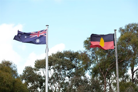 This is a photograph of the Australian and Aboriginal flags flying outside the Shire offices.