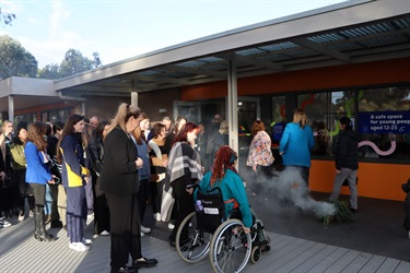 This is a photograph of the smoking ceremony at official opening of the Nillumbik Youth Hub