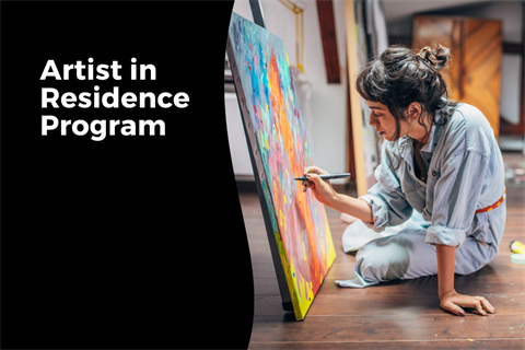 Artist in Residence Program words with image of an artist sitting on the floor painting